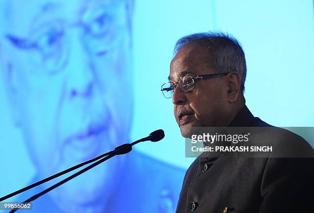 Indian Finance Minister Pranab Mukherjee delivers his speech during an Indo-Pak Business meet in New Delhi on May 18, 2010. Confedration of Indian...