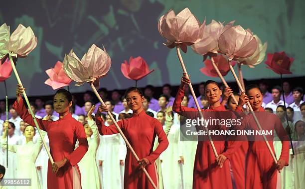 Dancers perform during a ceremony in Hanoi on May 18, 2010 to mark the 120th anniversary of the birthday of modern Vietnam's founder, the late...