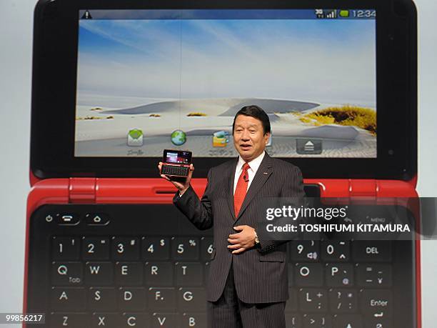 Japanese mobile operator NTT DoCoMo president Ryuji Yamada introduces the company's new Android-OS smartphone, LYNX, SH-10B during their summer...