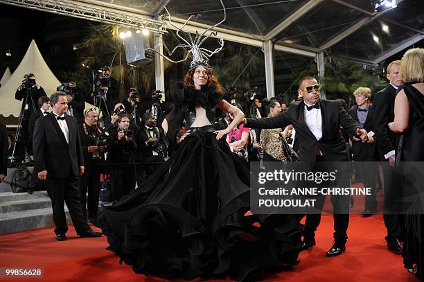 Guests arrive for the screening of "Outrage" presented in competition at the 63rd Cannes Film Festival on May 17, 2010 in Cannes. AFP PHOTO /...