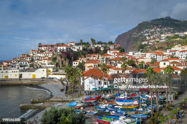 aerial view to camara de lobos town and fishing boats harbor - camara de photos stock pictures, royalty-free photos & images