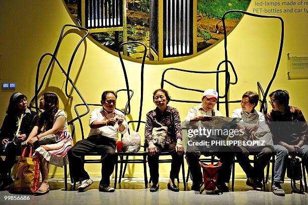 Visitors take a break inside the Swedish pavilion at the site of the World Expo 2010 in Shanghai on May 18, 2010. Organisers expect 70 million...