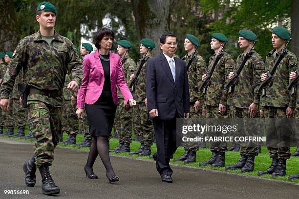 Swiss President Doris Leuthard walks with her Vietnamese counterpart Nguyen Minh Triet as they inspect a guard of honour upon his arrival for an...