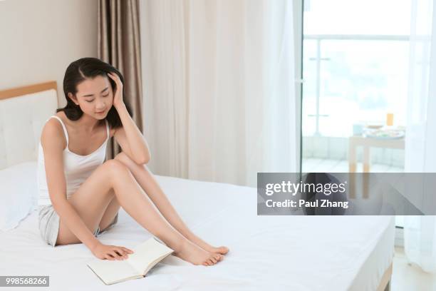 young woman in bedroom - young woman full body isolated stock pictures, royalty-free photos & images