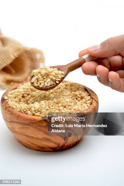 bowl full of rice ready to be cooked. - adzuki bean stock pictures, royalty-free photos & images