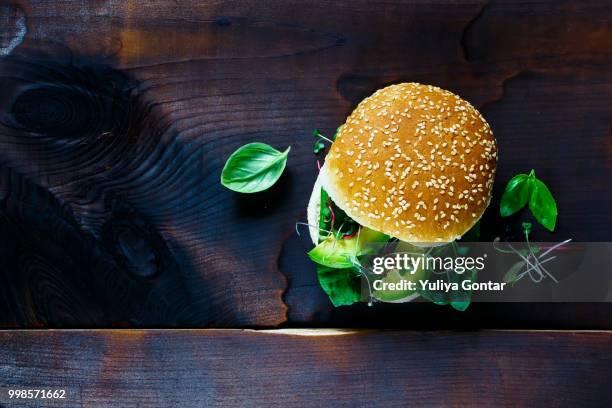 sandwich over old wood - sesame seed bun stock pictures, royalty-free photos & images