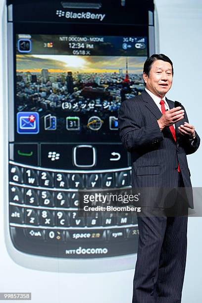 Ryuji Yamada, president of NTT DoCoMo Inc., holds the company's Research In Motion Ltd. BlackBerry Bold 9700 smartphone during an unveiling of the...