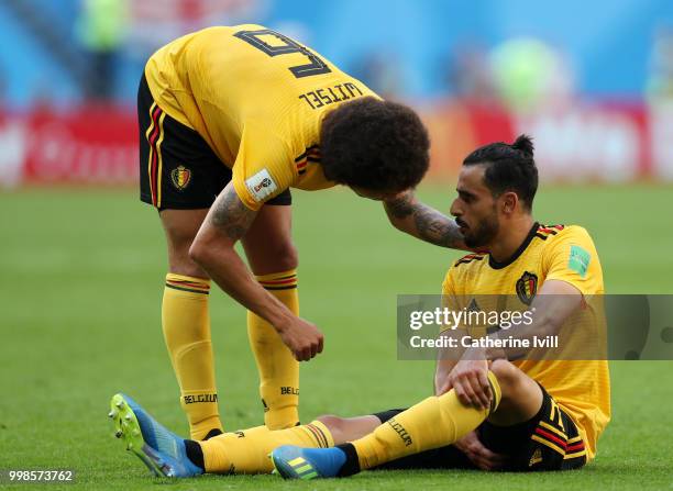 Axel Witsel of Belgium checks on teammate Nacer Chadli of Belgium as he goes down injured during the 2018 FIFA World Cup Russia 3rd Place Playoff...