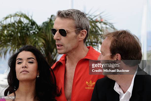 Actress Sabrina Ouazani, actor Lambert Wilson and Director Xavier Beauvois attend "Of Gods And Men" Photocall at the Palais des Festivals during the...