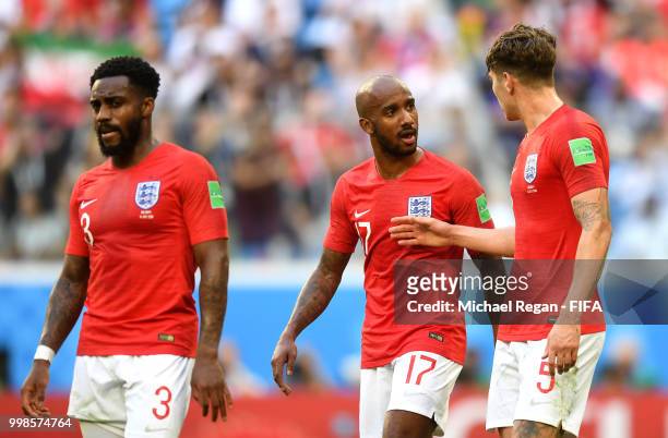 Fabian Delph of England speaks with John Stones of England during the 2018 FIFA World Cup Russia 3rd Place Playoff match between Belgium and England...