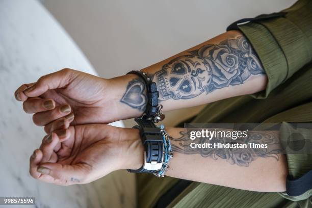 Bollywood director, actor and film maker Pooja Bhatt shows her tattos during an exclusive interview with HT City-Hindustan Times, on July 7, 2018 in...