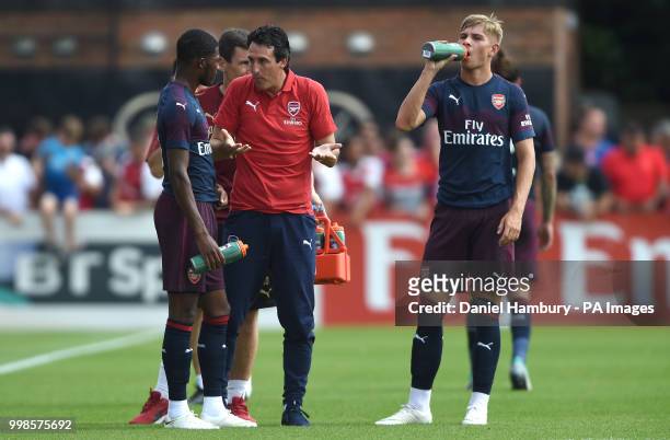 Arsenal manager Unai Emery gives instructions to Ainsley Maitland-Niles as Emile Smith Rowe looks on during the pre-season match at Meadow Park,...