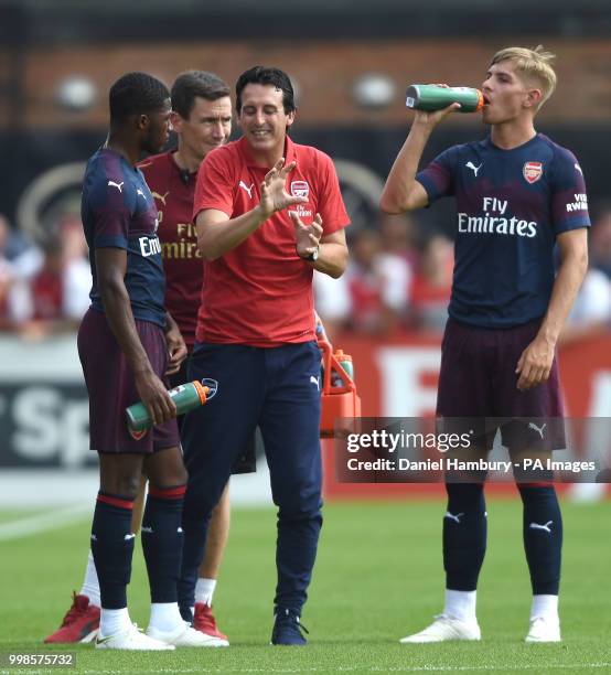 Arsenal manager Unai Emery gives instructions to Ainsley Maitland-Niles as Emile Smith Rowe looks on during the pre-season match at Meadow Park,...