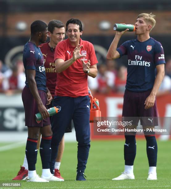 Arsenal manager Unai Emery gives instructions to Ainsley Maitland-Niles as Emile Smith Rowe looks on during the pre-season match at Meadow Park,...