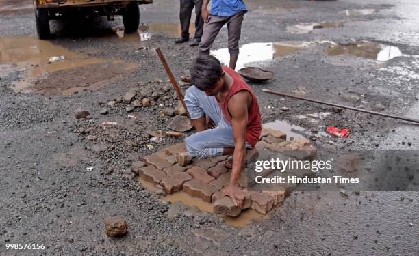 The recent heavy spell of showers has increased the problem of commuters as huge potholes have appeared on various roads in the city after rain under...