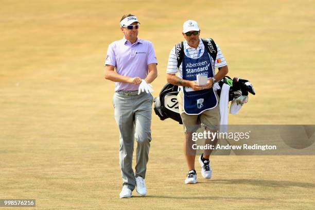 Ian Poulter of England talks to his caddy Terry Mundy on hole four during day three of the Aberdeen Standard Investments Scottish Open at Gullane...