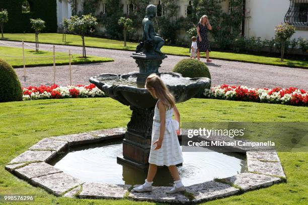 Princess Estelle of Sweden plays around a fountain during the occasion of The Crown Princess Victoria of Sweden's 41st birthday celebrations at...