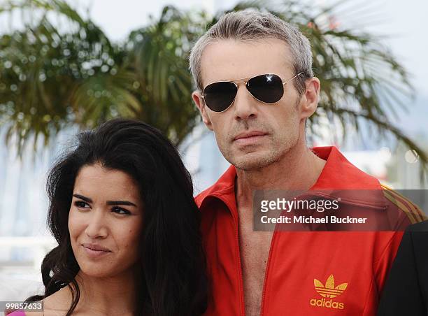 Actress Sabrina Ouzani and actor Lambert Wilson attend the "Of Gods And Men" Photocall at the Palais des Festivals during the 63rd Annual Cannes Film...