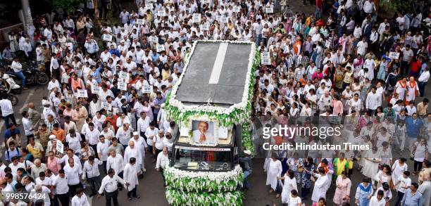 Thousand of people gather behind the funeral procession of Dada JP Vaswani at Sadhu Vaswani Mission, on July 13, 2018 in Pune, India. Dada Vaswani...