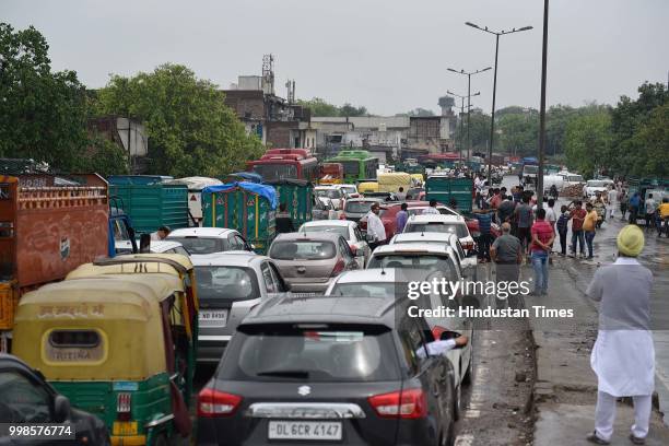 Massive traffic jam after heavy rainfall results in water logging on Rohtak road, near Anand Parbat, on July 14, 2018 in New Delhi, India. The rains...