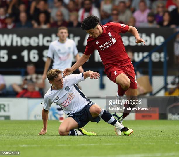 Curtis Jones of Liverpool competes with Callum Styles of Bury during the Pre-Season friendly match between Bury and Liverpool at Gigg Lane on July...
