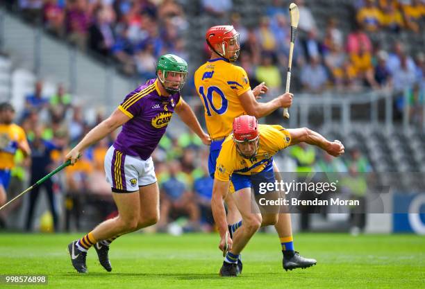 Cork , Ireland - 14 July 2018; John Conlon of Clare gets away from team-mate Peter Duggan and Matthew O'Hanlon of Wexford during the GAA Hurling...