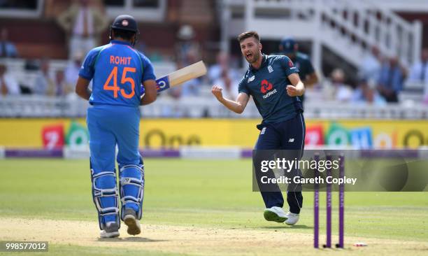 Mark Wood of England celebrates dismissing Rohit Sharma of India during the 2nd ODI Royal London One-Day match between England and India at Lord's...