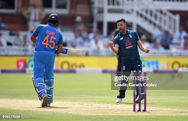 Mark Wood of England celebrates dismissing Rohit Sharma of India during the 2nd ODI Royal London One-Day match between England and India at Lord's...