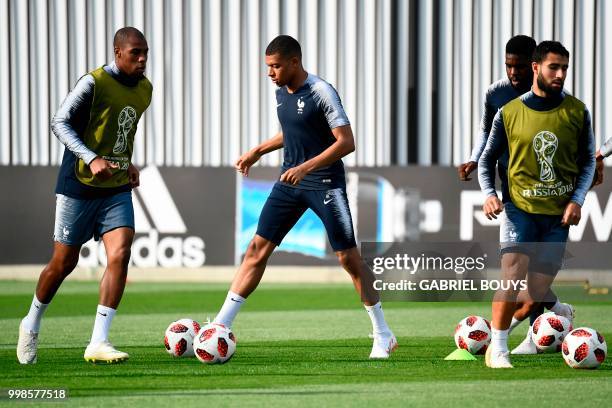 France's defender Djibril Sidibe, France's forward Kylian Mbappe, France's defender Samuel Umtiti and France's midfielder Nabil Fekir take part in a...