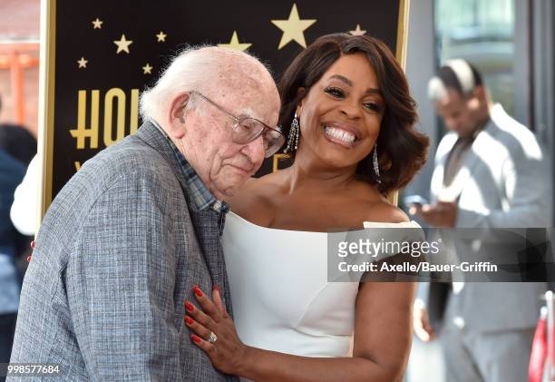 Actors Niecy Nash and Ed Asner attend the ceremony honoring Niecy Nash with star on the Hollywood Walk of Fame on July 11, 2018 in Hollywood,...