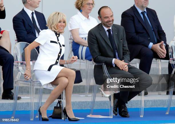 Wife of French President, Brigitte Macron and French Prime minister Edouard Philippe attend the traditional Bastille Day military parade on the...