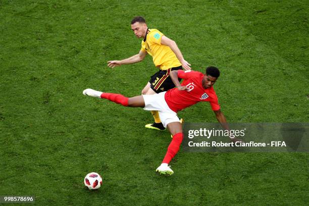 Thomas Vermaelen of Belgium tackles Marcus Rashford of England during the 2018 FIFA World Cup Russia 3rd Place Playoff match between Belgium and...