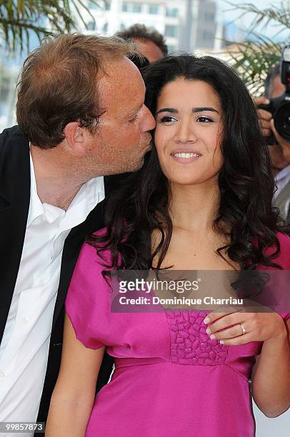 Director Xavier Beauvois and actress Sabrina Ouazani attend the 'Of Gods and Men' Photo Call held at the Palais des Festivals during the 63rd Annual...