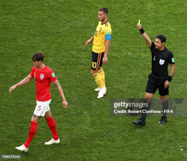 John Stones of England is shown a yellow card by referee Referee Alireza Faghani during the 2018 FIFA World Cup Russia 3rd Place Playoff match...