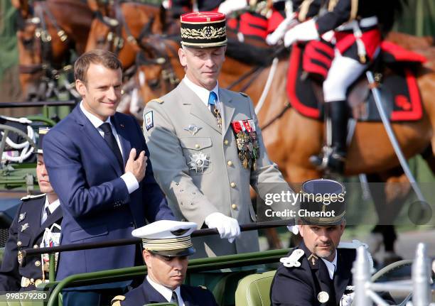 French President Emmanuel Macron and Chief of the Defence Staff French Army General Francois Lecointre arrive in a command car for the traditional...