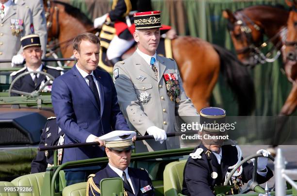French President Emmanuel Macron and Chief of the Defence Staff French Army General Francois Lecointre arrive in a command car for the traditional...