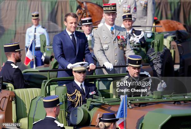 French President Emmanuel Macron and Chief of the Defence Staff French Army General Francois Lecointre arrive in a command car for the traditional...