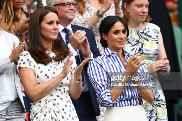 Catherine, Duchess of Cambridge and Meghan, Duchess of Sussex applaud ahead of the Ladies' Singles final match between Serena Williams of The United...