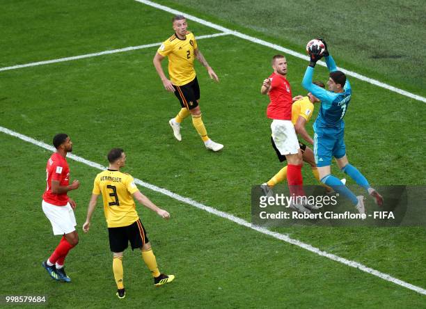 Thibaut Courtois of Belgium catches the ball under pressure from Eric Dier of England during the 2018 FIFA World Cup Russia 3rd Place Playoff match...