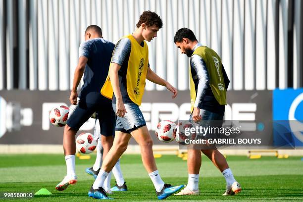 France's defender Benjamin Pavard and France's midfielder Nabil Fekir take part in a training session at the Luzhniki Stadium training field in...