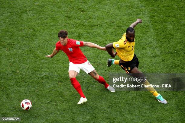 John Stones of England is challenged by Romelu Lukaku of Belgium during the 2018 FIFA World Cup Russia 3rd Place Playoff match between Belgium and...