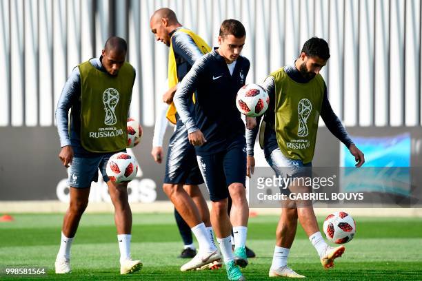 France's defender Djibril Sidibe, France's midfielder Steven N'Zonzi, France's forward Antoine Griezmann and France's midfielder Nabil Fekir take...