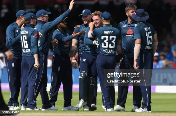 England players rush to congratulate Jos Buttler after he had caught Rahul off Liam Plunkett during the 2nd ODI Royal London One Day International...