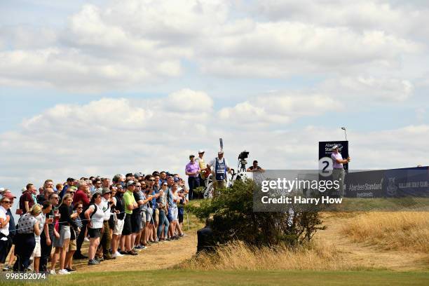 Ian Poulter of England takes his tee shot on hole two during day three of the Aberdeen Standard Investments Scottish Open at Gullane Golf Course on...