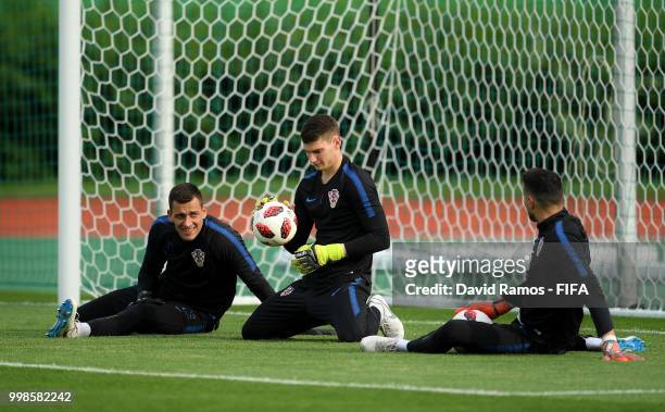 Lovre Kalinic, Dominik Livakovic and Danijel Subasic of Croatia take part in a Croatia training session during the 2018 FIFA World Cup at Luzhniki...