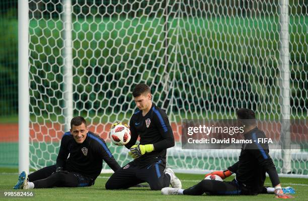 Lovre Kalinic, Dominik Livakovic and Danijel Subasic of Croatia take part in a Croatia training session during the 2018 FIFA World Cup at Luzhniki...