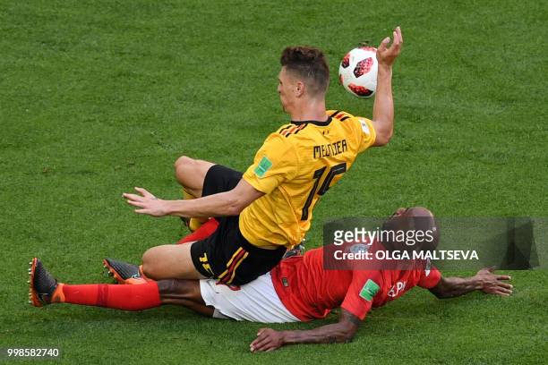 England's midfielder Fabian Delph vies for the ball with Belgium's defender Thomas Meunier during their Russia 2018 World Cup play-off for third...