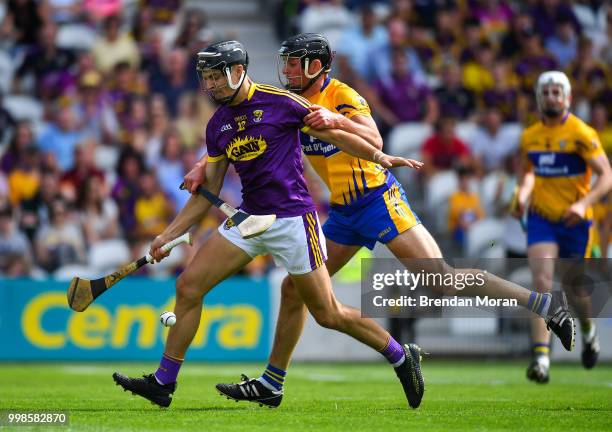 Cork , Ireland - 14 July 2018; Jack O'Connor of Wexford in action against Cathal Malone of Clare during the GAA Hurling All-Ireland Senior...