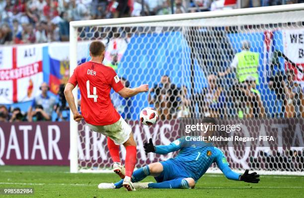 Eric Dier of England takes on Thibaut Courtois of Belgium before he then shoots during the 2018 FIFA World Cup Russia 3rd Place Playoff match between...