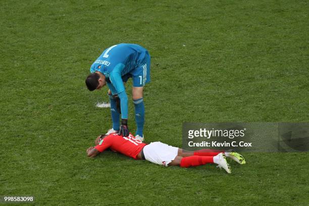 Thibaut Courtois of Belgium checks on Marcus Rashford of England who goes down injured during the 2018 FIFA World Cup Russia 3rd Place Playoff match...
